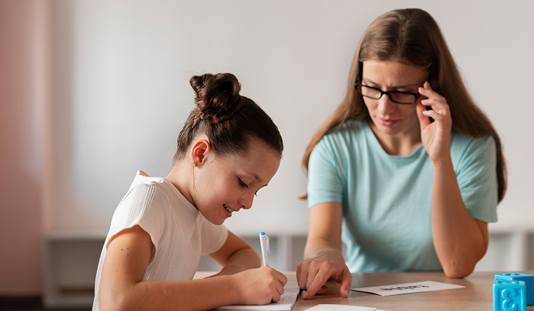 Child undergoing developmental assessment with a specialist to evaluate learning and growth