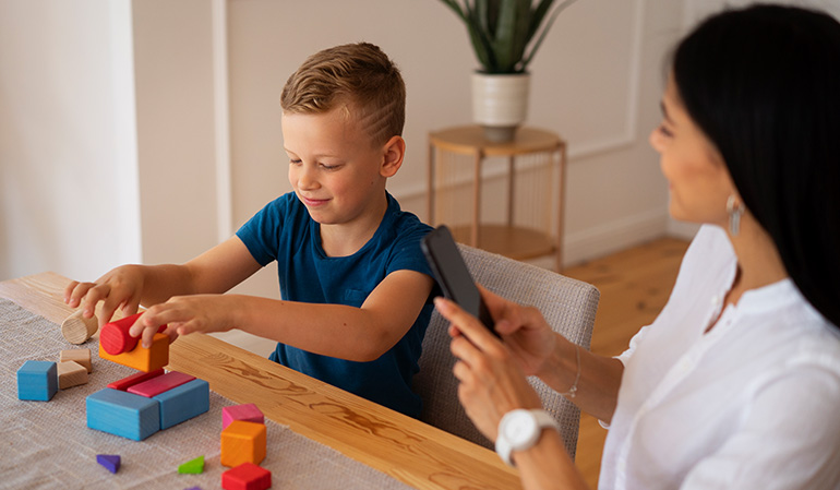 Child practicing daily living and motor skills during an occupational therapy session