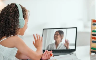Child attending online speech therapy session at AIMS Child Development Center in Kerala