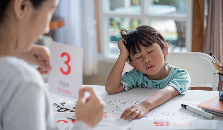Child showing signs of inattention and difficulty concentrating during a learning session, highlighting the importance of an ADHD Assessment for identifying attention and behavioral challenges in children.