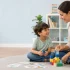 Child development therapist helping a child with speech and behavioral communication skills